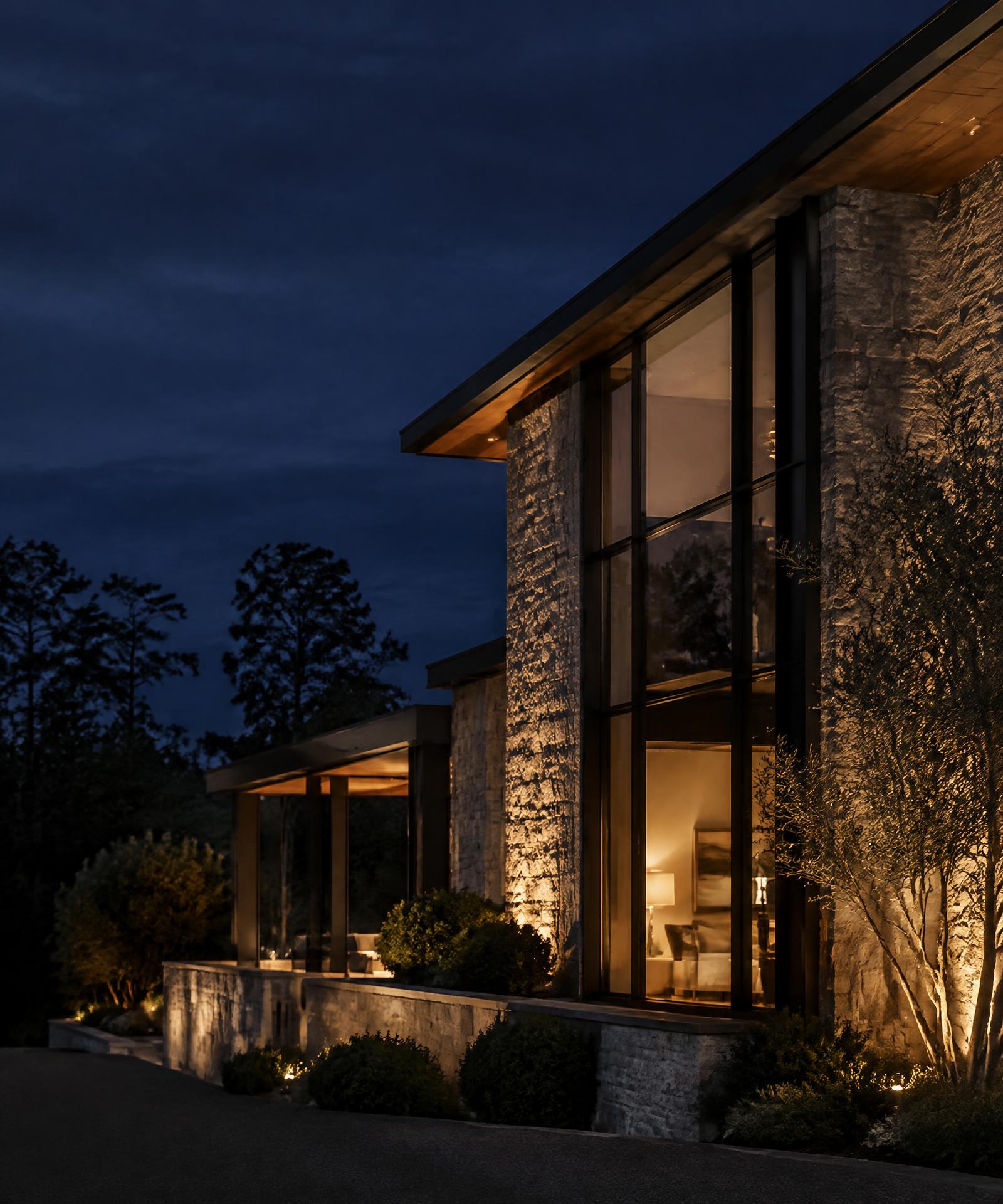 Modern Georgia estate in stone and glass at night